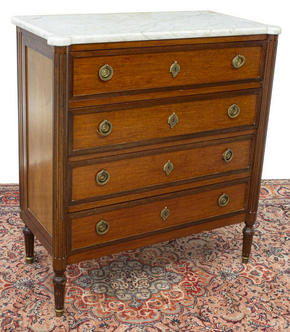 FRENCH LOUIS XVI STYLE MARBLE-TOP MAHOGANY COMMODE: French Louis XVI style mahogany commode, 20th c., marble top over case fitted with four drawers, flanked by fluted columns, rising on fluted tapered legs, approx 39.5"h, 36.5"w, 17.75"d Start Price: $