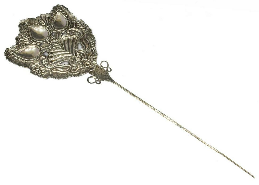 OVERSIZED SILVER TUPU/ SHAWL PIN, 25"L: Oversized silver (content unknown) tupu/ shawl pin, Central or South America, with repousse scroll and foliate motifs, unmarked, approx 24.75"l, 8"w, 302 grams Start Price: $100.00