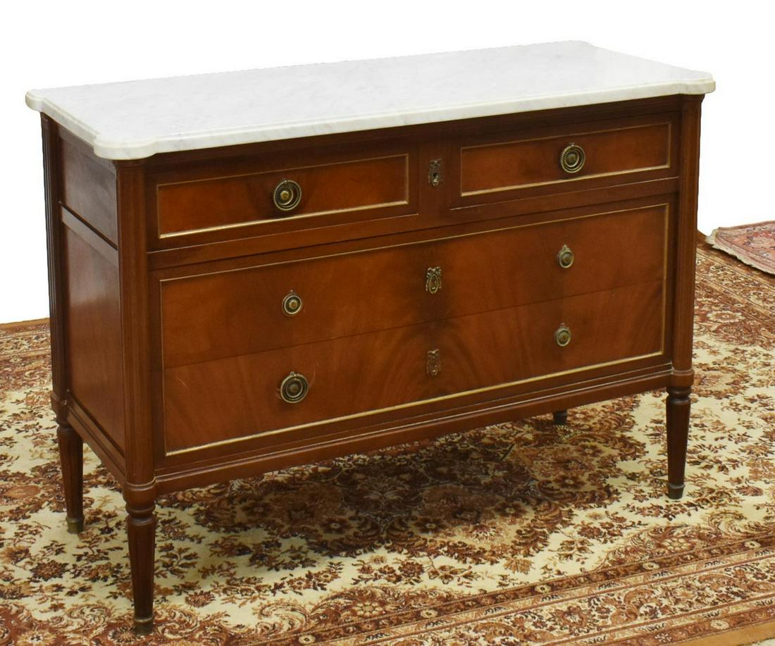 FRENCH LOUIS XVI STYLE MARBLE-TOP MAHOGANY COMMODE: French Louis XVI style marble-top mahogany commode, 19th c., having rectangular marble top, fluted sides, four drawers, wreath-form escutcheon, hanging pulls with beadwork, on fluted tapered legs, lac