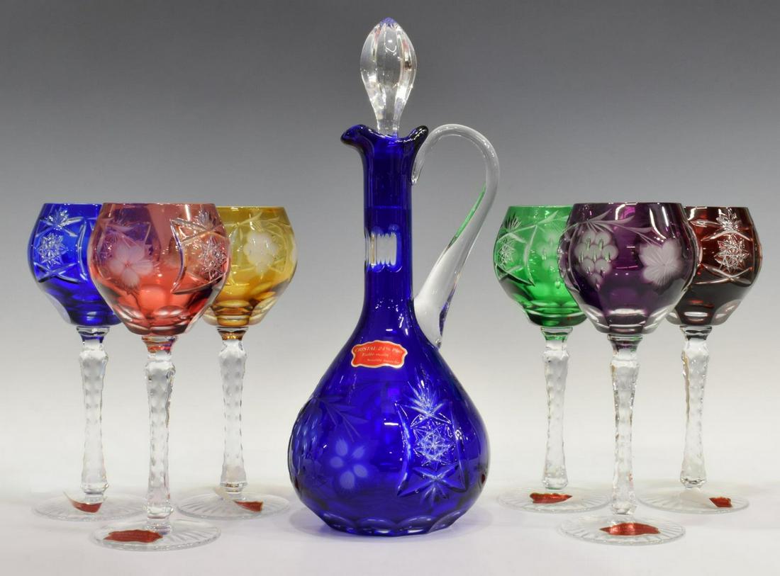 (7) FRENCH ART GLASS WINE STEMS & EWER DECANTER: (lot of 7) French hand-blown cut-to-clear art glass drinks service, in original fitted box, comprising: (6) wine stems, varied colors, cut bowl with floral motif, textured stem, star cut foot, approx 