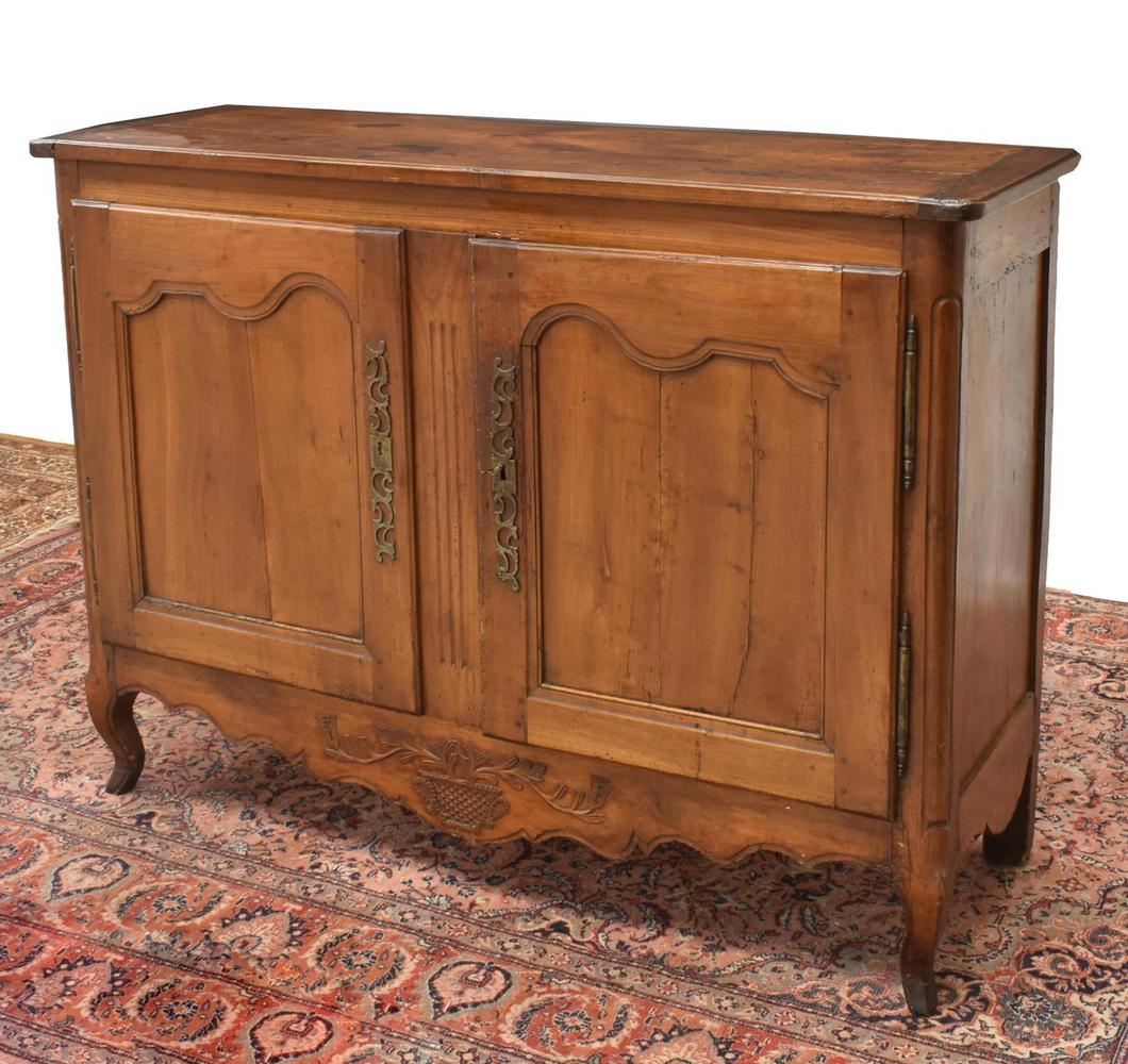 FRENCH LOUIS XV STYLE FRUITWOOD SIDEBOARD, 19TH C.: French Provincial Louis XV style fruitwood sideboard, 19th c., rectangular case fitted with paneled double doors, long exterior hinges, elaborate scrolled escutcheon, opening to interior shelves, shap
