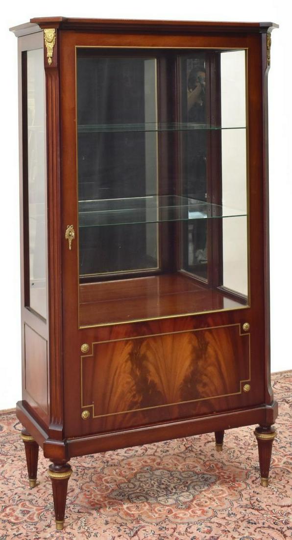 FRENCH LOUIS XVI STYLE MAHOGANY VITRINE: French Louis XVI style mahogany vitrine, 20th c., cornice top, over case fitted with glazed door and sides, interior with two glass shelves over wood shelf, mirrored back, flanked by fluted edges, hav