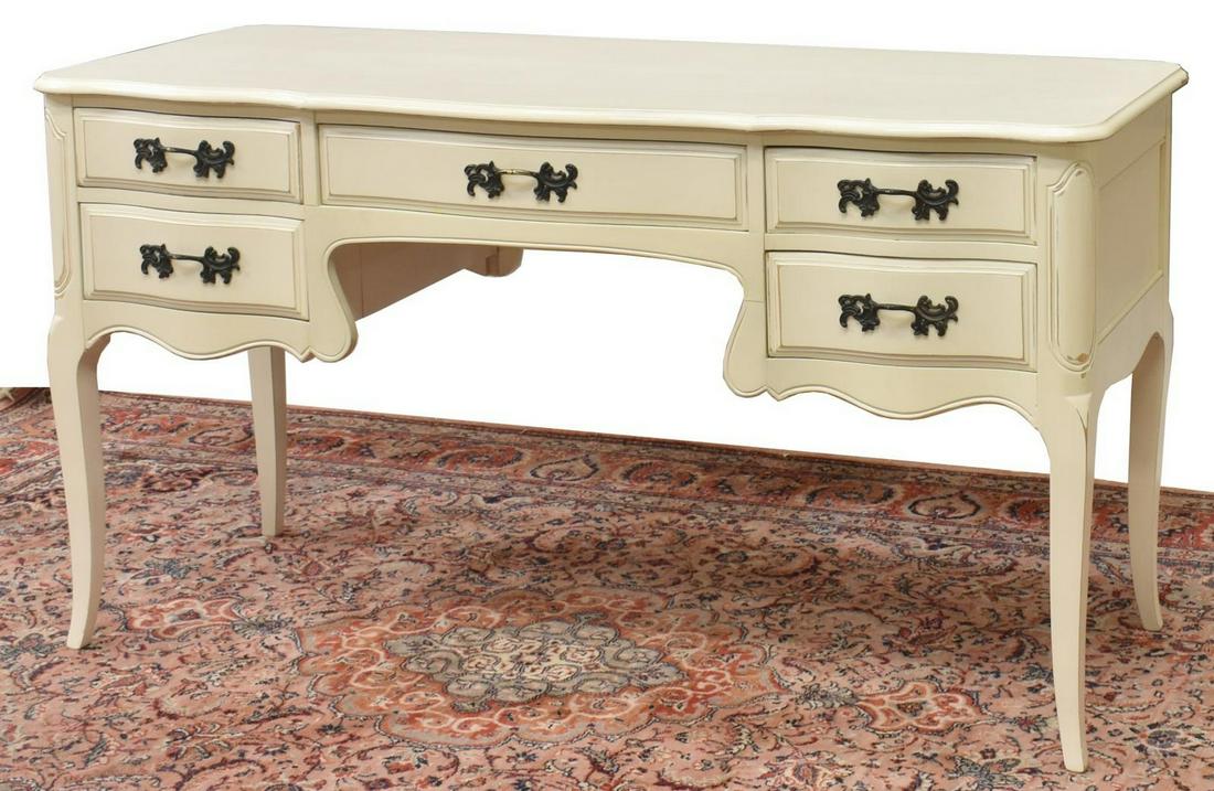 LOUIS XV STYLE PAINTED WRITING DESK: Louis XV style painted writing desk, 20th c., having shaped top, center drawer over kneehole, flanked by four side drawers, foliate drawer pulls, rising on cabriole legs, cracking to paint finish on t