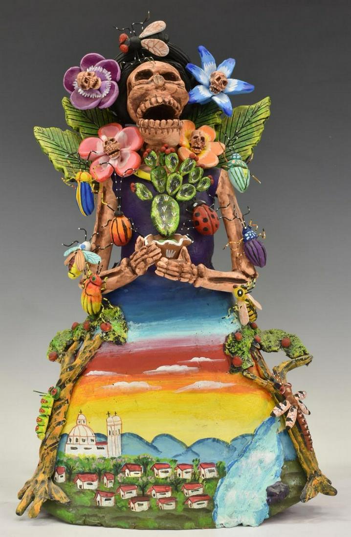 JOSEFINA AGUILAR (B.1945) OAXACA CLAY MUNECA: Folk art pottery muneca, Josefina Aguilar (Ocotlan de Morelos, Oaxaca, Mexico, b.1945), female skeletal figure, holding a potted cactus, surrounded by skull flowers and beetles, loss at restoration to