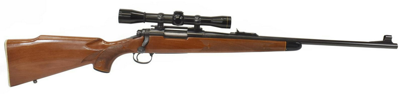 REMINGTON 700 RIFLE .243WIN CALIBER, LEUPOLD SCOPE: Remington Model 700 rifle, bolt action, .243Win caliber, 22" barrel, hooded front sight, adjustable rear sight, mounted Leupold M8-4X scope, checkered hardwood stock with cheek piece, two sling posts,
