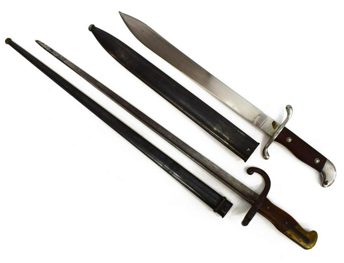 (2) BAYONETS, SCARCE STEYR GRAS & 1909 ARGENTINE: (lot of 2) Bayonets: (1) Argentine Model 1909 bayonet, the 14.75" blade marked at the ricasso with the Argentine crest, the opposite ricasso with the maker Wyersburg & Kirchbaum Co., Solingen, a wood 
