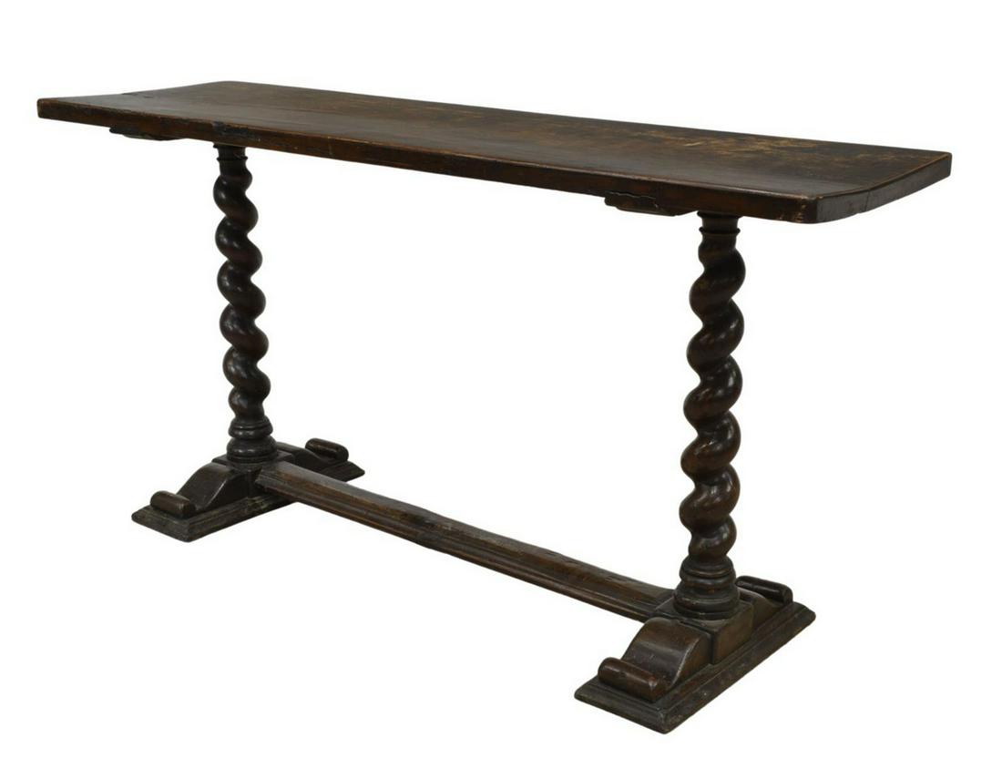 SPANISH BAROQUE STYLE WALNUT CONSOLE TABLE: Spanish Baroque style walnut console table, 19th c., having a long rectangular single-board top, over spiraled supports, on stretcher-joined base, restoration to one leg and wood loss to leg under top
