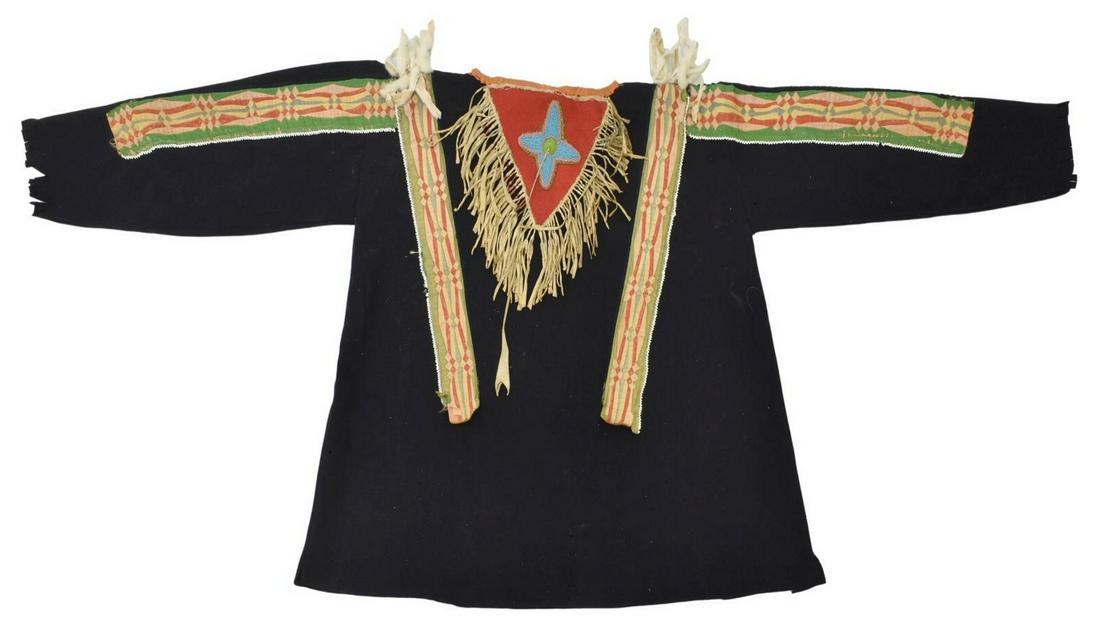 PRAIRIE OR GREAT LAKES BEADED SHIRT, C.1880-1900: Native American wool shirt, Prairie or Great Lakes, c.1880-1900, beaded bib with ermine tails, applied ribbonwork strips, sleeves: approx 18"l, collar to hem: approx 26"l, 1.25lbs Start Price: $600.00