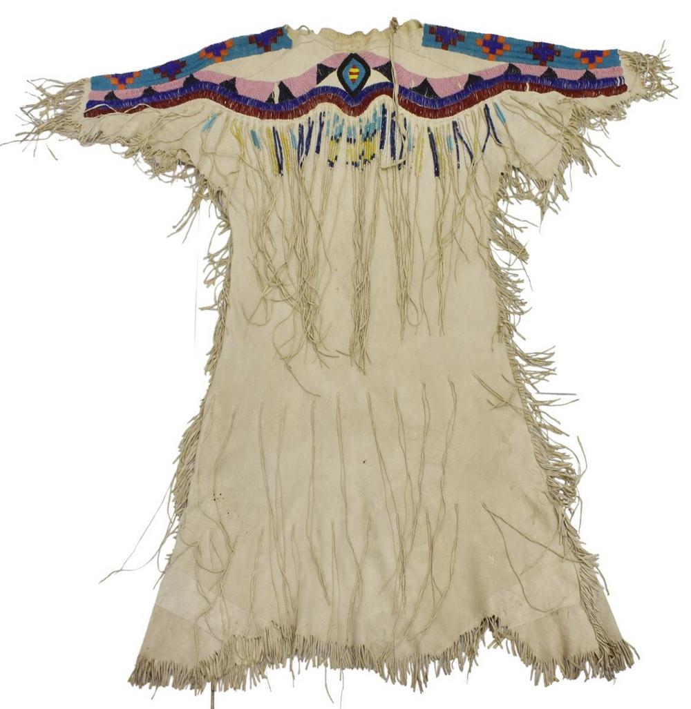 PLATEAU BEADED HIDE DRESS, C.1930-1950: Native American beaded hide dress, Plateau, c.1930-1950, fringe, attached ribbon: "Second Prize, Inter-Tribal Indian Ceremonial, Gallup, New Mexico, 1966," sleeves: approx 9"l, collar to hem: approx 4