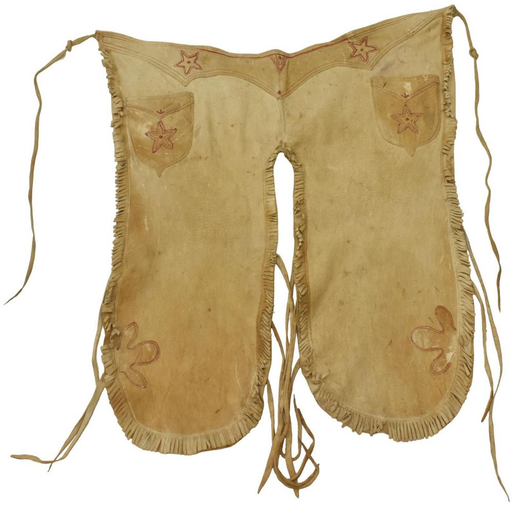 WESTERN HIDE CHAPS NEEDLEWORK STARS, C.1900-1920: Western hide chaps, c.1900-1920, needlework star decorations at pockets and belt area, waist excluding ties: approx 32"w, waist to bottom of fringe at legs: approx 33"l, 1lbs Start Price: $50.00