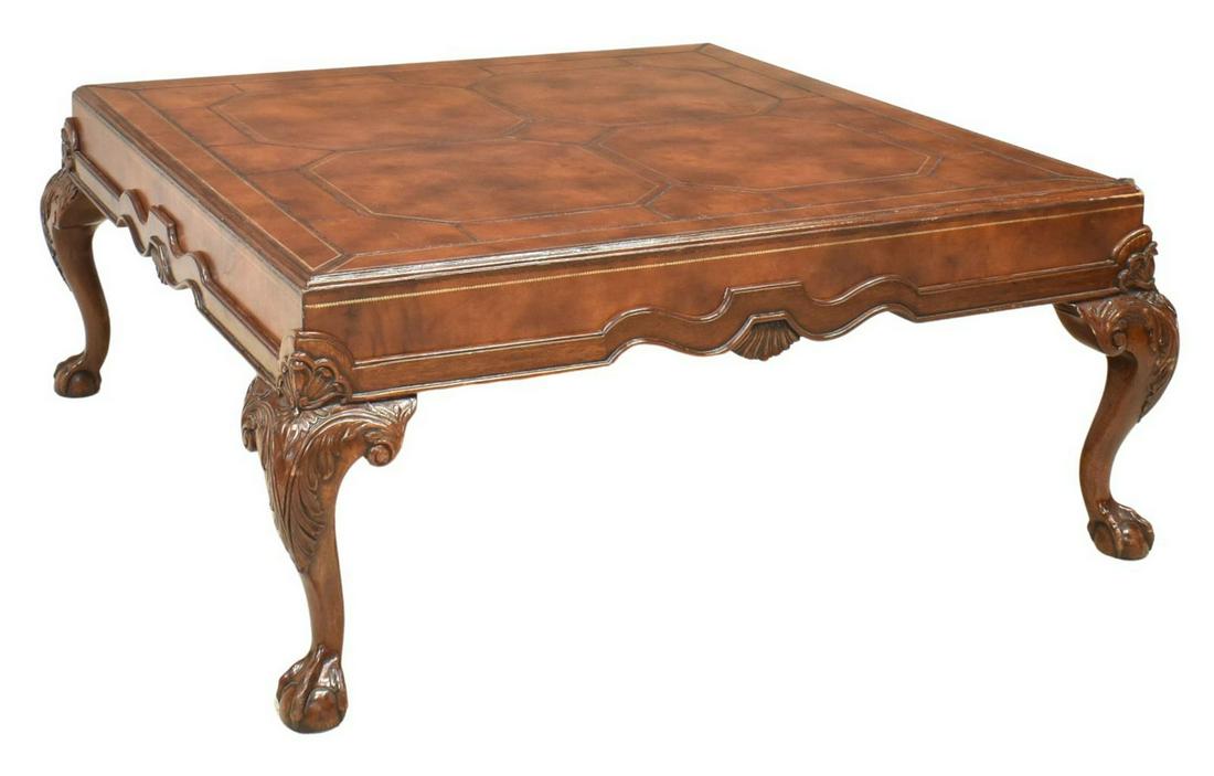CHIPPENDALE STYLE LEATHER MAHOGANY COFFEE TABLE: Chippendale style mahogany coffee table, 20th c., leather top and sides, top having gilt embossed border, over scalloped apron with carved shell motif, rising on cabriole legs with foliate carved knee