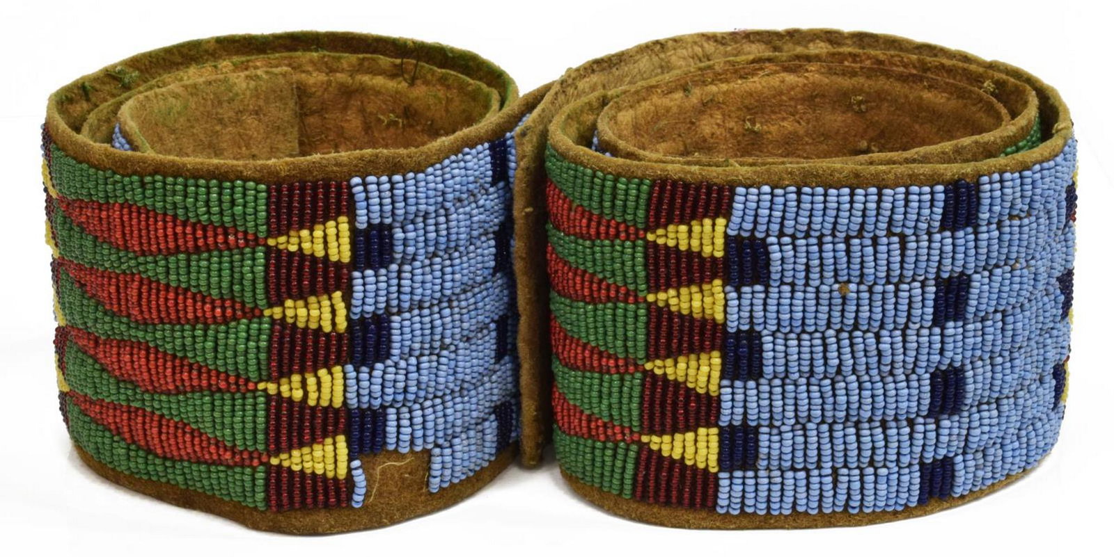 (2) SIOUX BEADED HIDE STRIPS, C.1880-1900: (pair) Native American beaded hide strips, Sioux, c.1880-1900, (1) approx 28.25"l, 2.75"w; (1) approx 28"l, 2.75"w; 0.75lbs total Start Price: $150.00