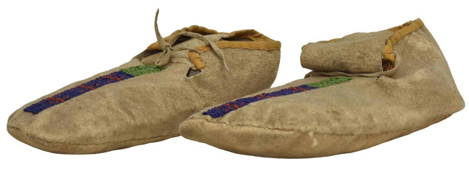 NORTHERN PLAINS BEADED HIDE MOCCASINS, C.1880-1900: Native American beaded hide moccasins, Northern Plains, c.1880-1900, approx 8.5"l, 0.25lbs Start Price: $200.00