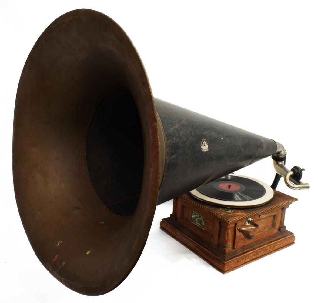 VICTOR 'TYPE D' TALKING MACHINE & 38" SOUND HORN: Victor Victrola Talking Machine/ Phonograph, c.1903-1907, Victor Talking Mch. Co., Camden, New Jersey, Type D, serial number 4828, having a 38" sound horn pavillon, over 12" turntable, on carved oak c