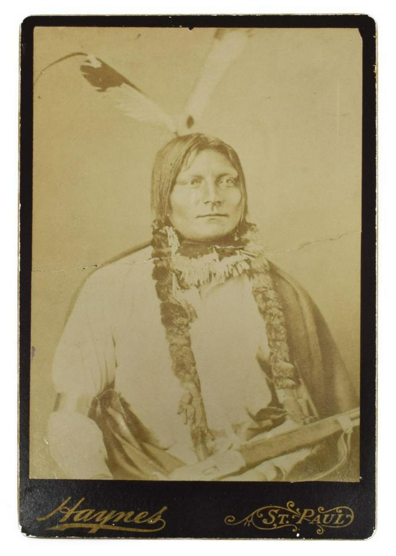 NATIVE AMERICAN CABINET CARD PHOTO, F. JAY HAYNES: Native American cabinet photograph, possibly Crow, late 19th c., in ink at the back: "This is for Marry & Anthony," the back mark of F. J. Haynes & Bro., 392 Jackson St., St. Paul, Minn. (Frank Jay Ha