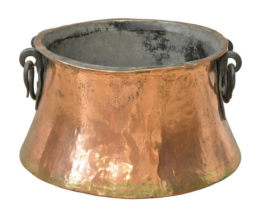 LARGE COPPER PLANTER W/ IRON HANDLES: Large copper planter, with iron handles, slightly rounded bottom, dents, patination, approx 11.5"h, 19"diam, 13.5lbs **Provenance: From the Snaffle Bit Ranch estate of David Dewhurst (b.1945), who ent
