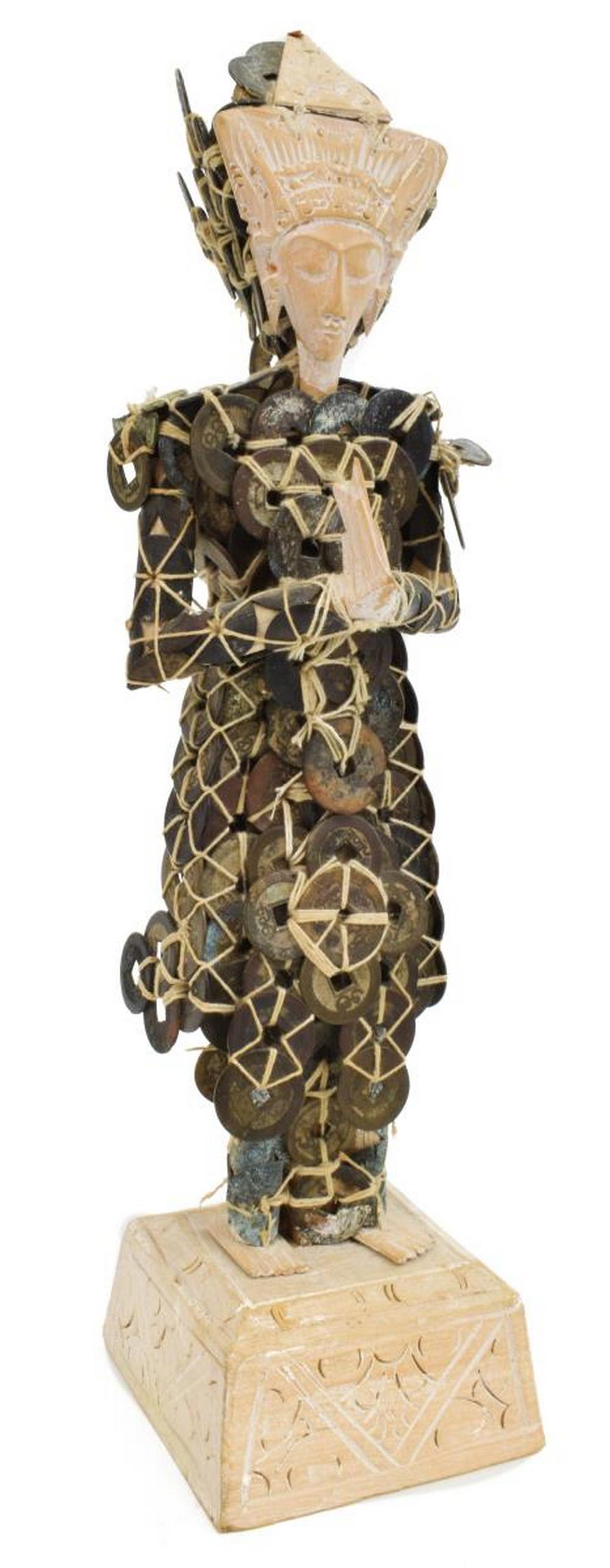INDONESIAN CARVED WOOD & COINS FIGURE: Southeast Asian carved wood figure, Bali, Indonesia, 20th c., with garments constructed from cord-wrapped coins, approx 14.5"h, 4"w, 3.75"d, 2.25lbs Start Price: $50.00