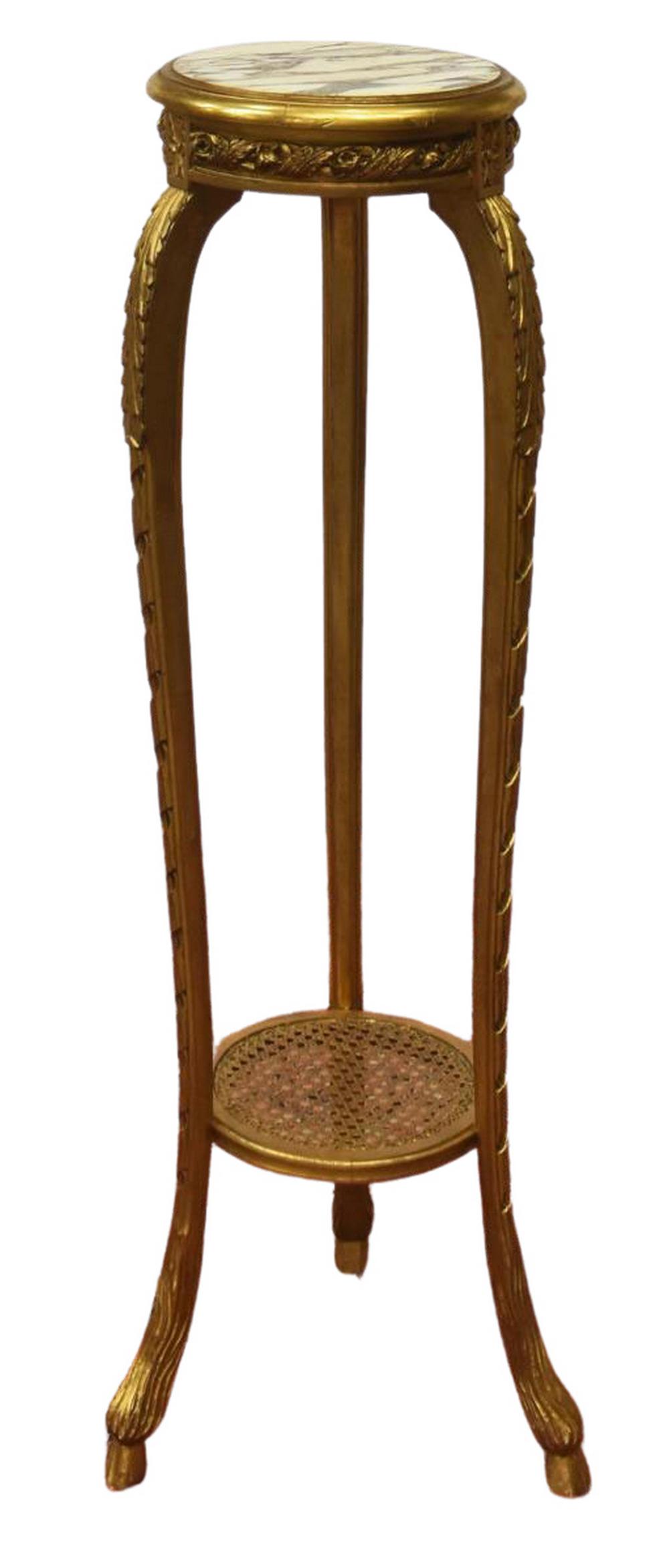 FRENCH LOUIS XVI STYLE MARBLE-TOP GILTWOOD STAND: French Louis XVI style giltwood stand, 19th c., having a circular inset marble top, foliate carved apron, acanthus leaf motifs, rising on cabriole legs, joined by caned medial shelf, hairlines to marb