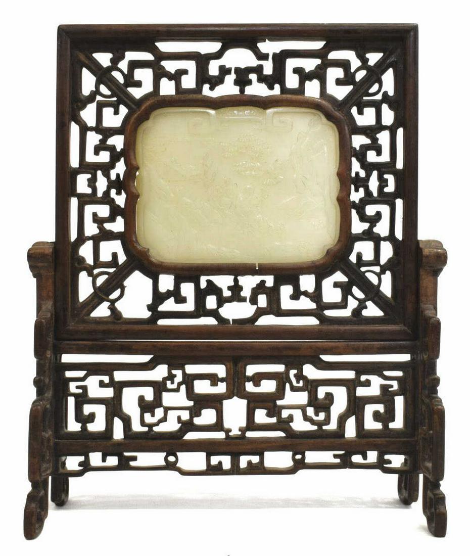CHINESE CARVED HARDWOOD & JADE TABLE SCREEN: Chinese hardwood table screen, carved jade plaque with figure in boat, screen with carved fretwork designs, restoration to base, plaque: approx 3.25"h, 4.25"w, overall: approx 10 1/8"h, 8 3/8"w, 3 1/8