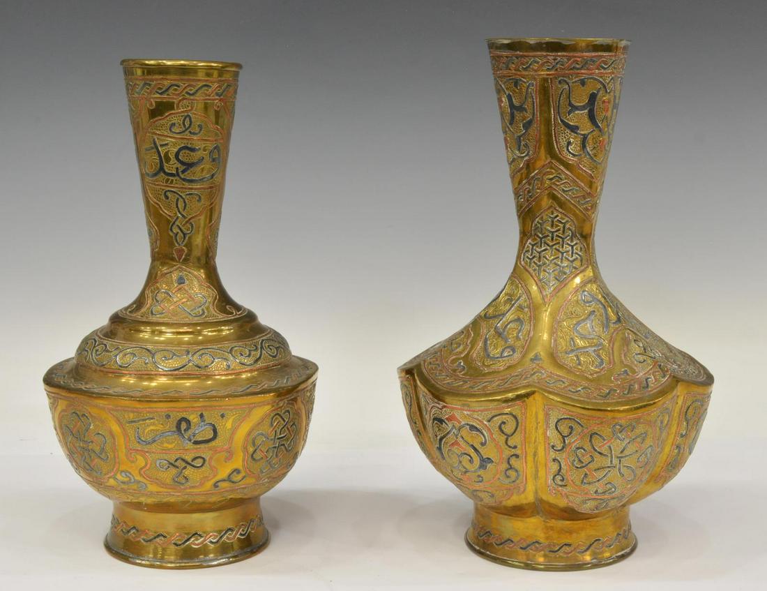 (2) ISLAMIC MIXED METAL INLAID BRASS VASES: (lot of 2) Islamic brass vases with mixed metal inlays, varied form, each decorated with arabesques and calligraphic motifs, largest: approx 12.5"h, 8"w; 6lbs total **Provenance: From the estate of Al