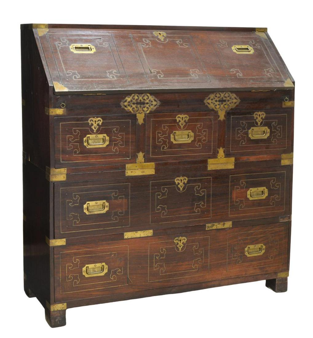 BRITISH COLONIAL ROSEWOOD SLANTFRONT CAMPAIGN DESK: British Colonial rosewood slant-front campaign desk, 20th c., case fitted with brass hardware and string inlay, slant-front opening to fitted interior gallery, with six drawers and open shelves, over 