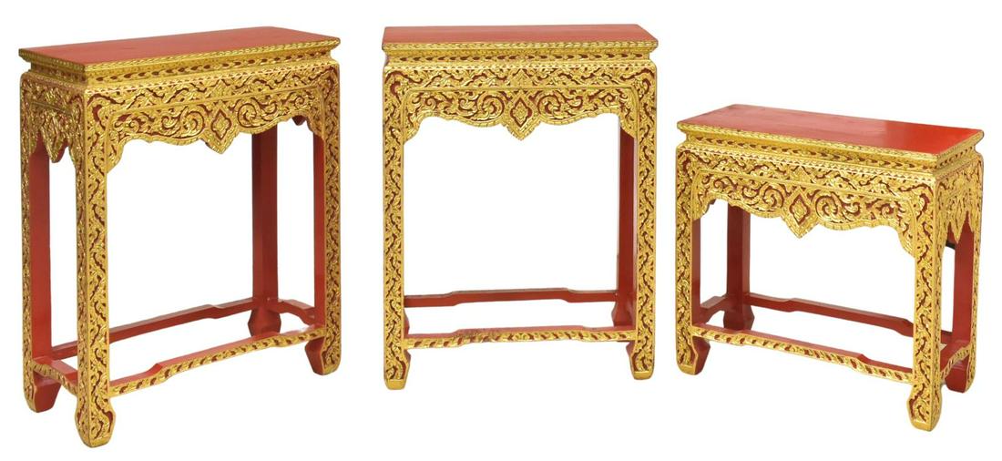 (3) THAI PARCEL GILT & RED LACQUERED TABLES: (lot of 3) Southeast Asian parcel gilt and red lacquered side tables, 20th c., similarly styled, varied sizes, each having rectangular top, over carved apron and legs, with elaborate scrolled foliate 