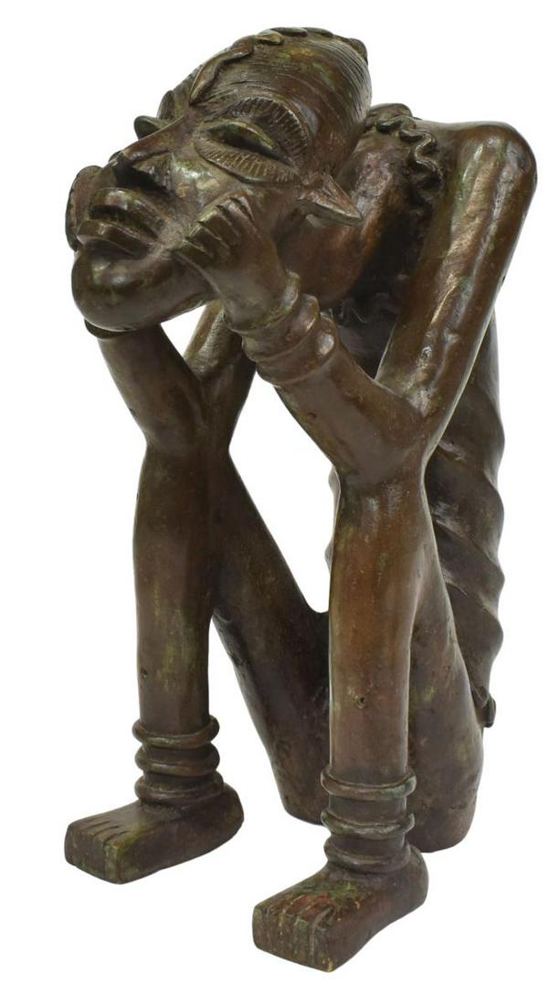 AFRICAN PATINATED BRONZE, SEATED TRIBAL FIGURE: Large African patinated bronze, Seated Tribal Figure, unsigned, approx 14"h, 5.75"w, 7"d, 16.25lbs **Provenance: From the estate of Ali A. Abssi (1934-2020) and Florence Hall Abssi (1919-2014), founde