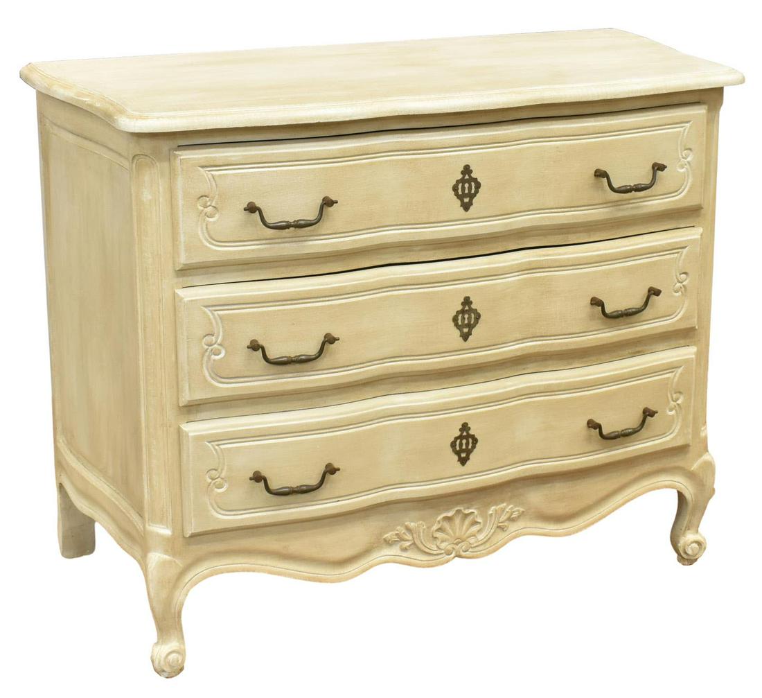 FRENCH LOUIS XV STYLE WHITE PAINTED COMMODE: French Louis XV style painted commode, 20th c., having a shaped top, over serpentine case fitted with three drawers, carved shell and foliate motifs, rising on cabriole legs, ending in whorl feet, app