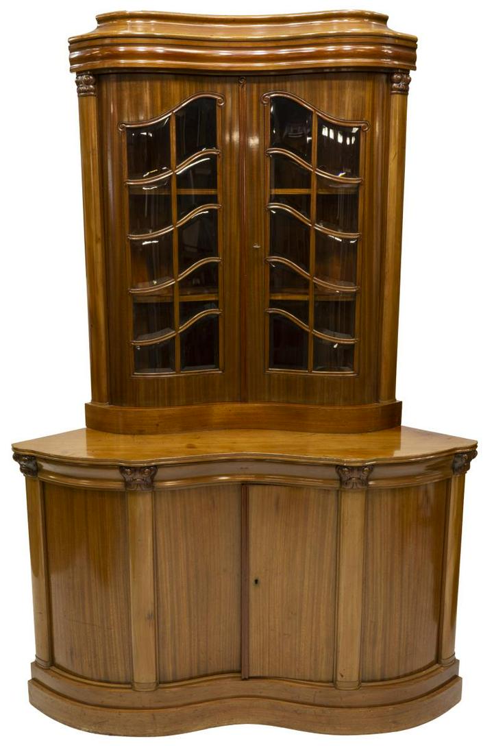DANISH MAHOGANY CORNER DISPLAY CABINET: Danish mahogany display cabinet, having stepped cornice at top, two shelves fitted behind glass doors comprised of beveled glass panes, lower cabinet decorated with pilasters and scrolled capitals, wi