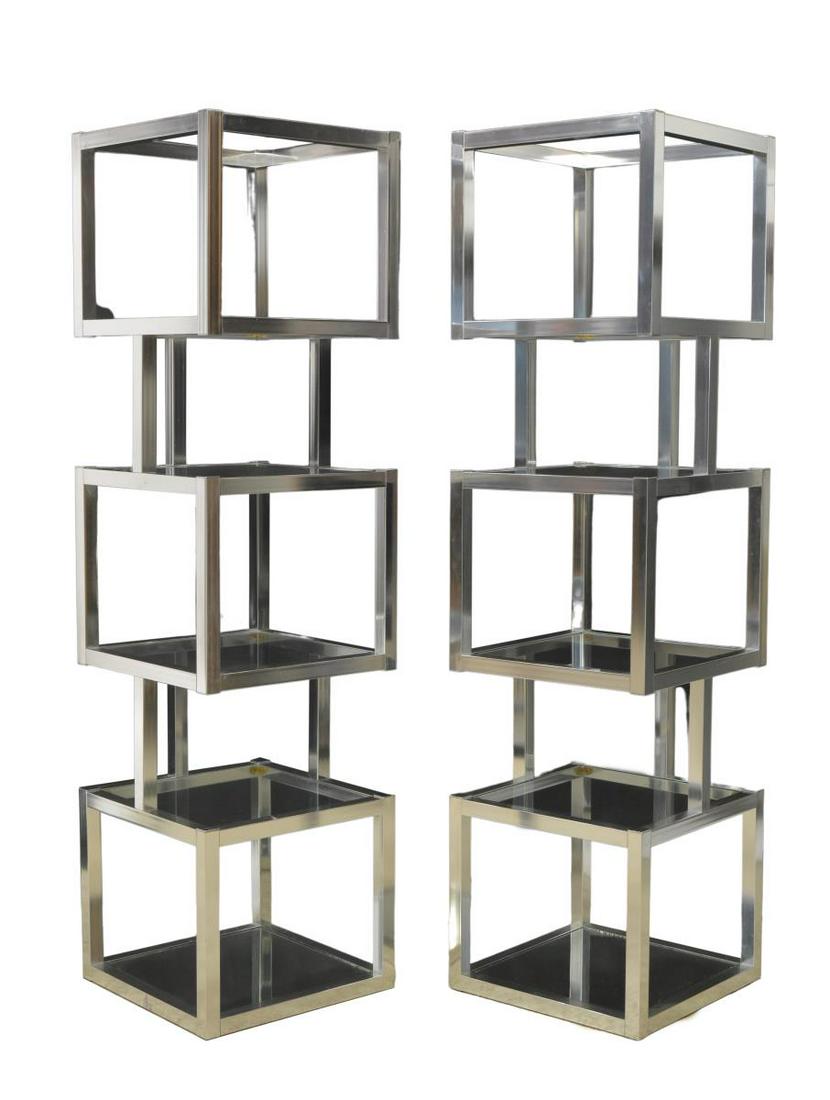 (2) MODERN CUBIST DESIGN CHORME & GLASS ETAGERES: (pair) Mid-century modern glass and chrome modular bookshelves/ etageres, in the manner of Milo Baughman (American, 1923-2003), c.1970s-1980s, geometric chrome frame of cubist design, housing four col