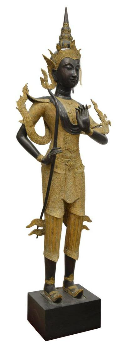 LARGE THAI GILT BRONZE PHRA RAMA ARCHER FIGURE: Thai gilt and patinated bronze figure, Phra Ram (Rama) as an archer, hand in Vitarka Mudra gesture, figure: approx 57.5"h, overall: approx 63"h, 16.75"w, 9.75"d **Provenance: From the estate of Ali A.