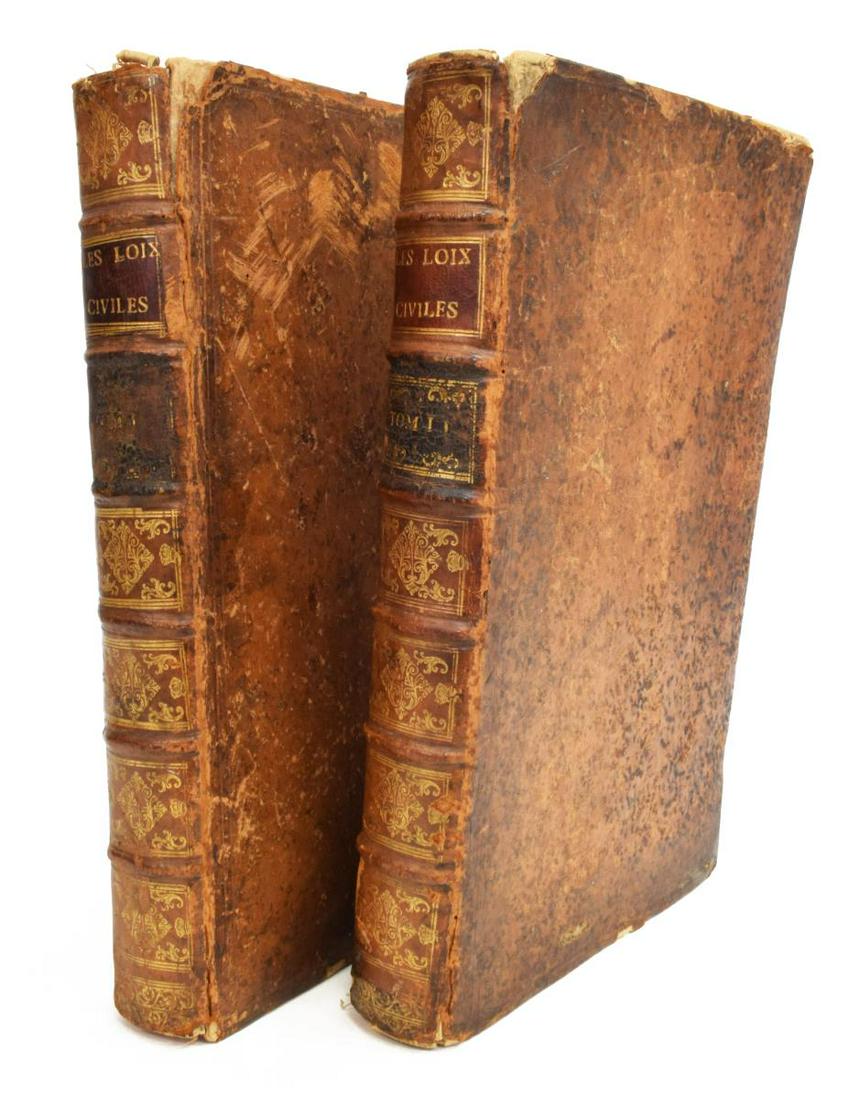 (2 VOL.) JEAN DOMAT 'LES LOIS CIVILES,' C.1771: (2 volumes) Book: "Les loix civiles dans leur ordre naturel. Le droit public, et legum delectus," Jean Domat (French, 1625-1696), c.1771, leather-backed spine over gilt embossed boards, marbled inside