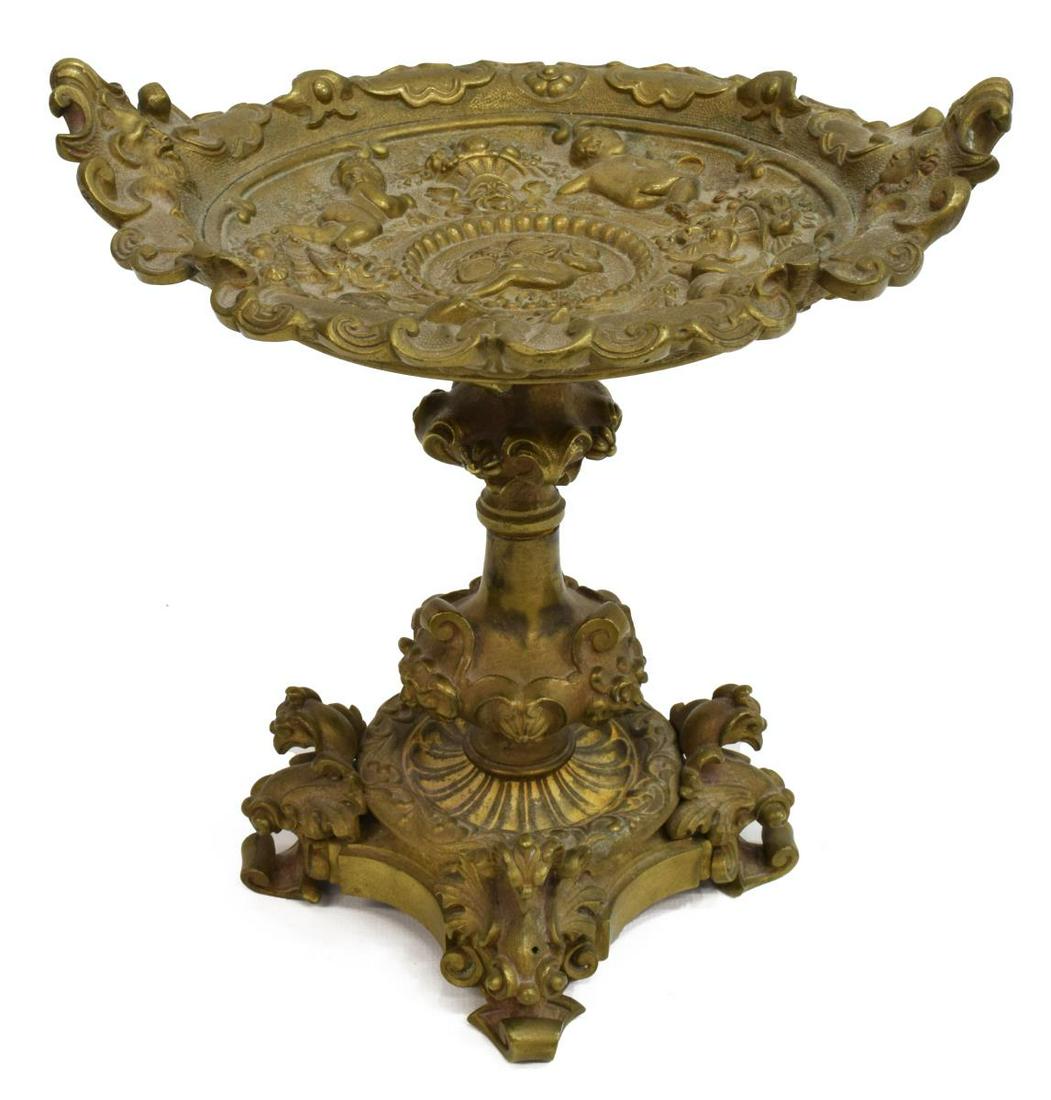 RENAISSNACE REVIVAL BRONZE TAZZA CARD TRAY: Renaissance Revival bronze tazza, late 19th c., shallow dish with putti in relief, knopped stem, base with bird-form supports, approx 8.25"h, 8"w, 7"d, 6lbs **Provenance: From the estate of Ali A. Abs