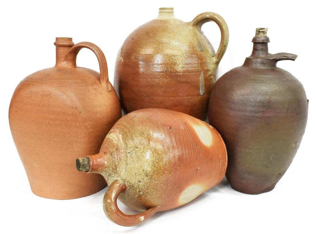(4) FRENCH EARTHENWARE POTTERY JUGS: (lot of 4) French earthenware pottery jugs, late 19th/ early 20th c., of various size, similarly styled, having single handle, narrow spout, (one) with broken handle, largest: approx 15"h, 9.5"diam, 2
