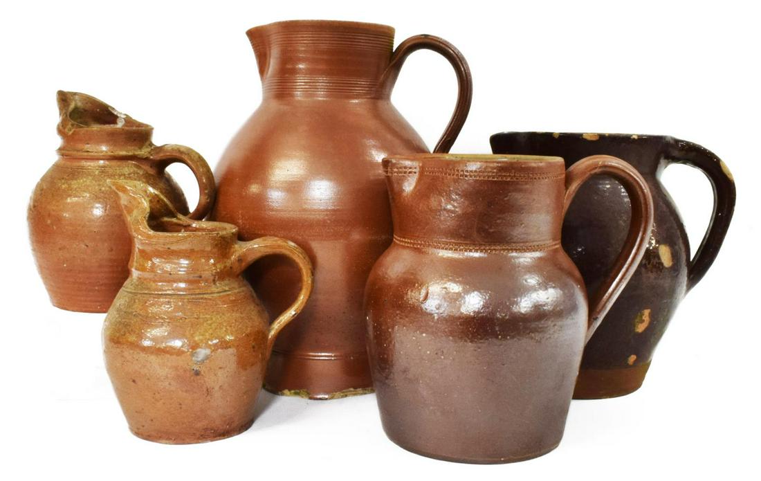 (5) ANTIQUE FRENCH EARTHENWARE HANDLED PITCHERS: (lot of 5) French earthenware handled pitchers, late 19th/ early 20th c., of varied size and form, overall intact with some chips and loss commensurate with age, largest: approx 12.5"h, 8"diam, 15.5lb