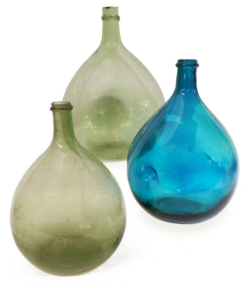 (3) FRENCH GREEN & AQUAMARINE GLASS CARBOYS: (lot of 3) French glass carboys, having narrow necks, rising from bulbous forms, blue bottle with loss to finish as pictured, largest: approx 14"h, 10"diam; 8.5lbs total Start Price: $100.00