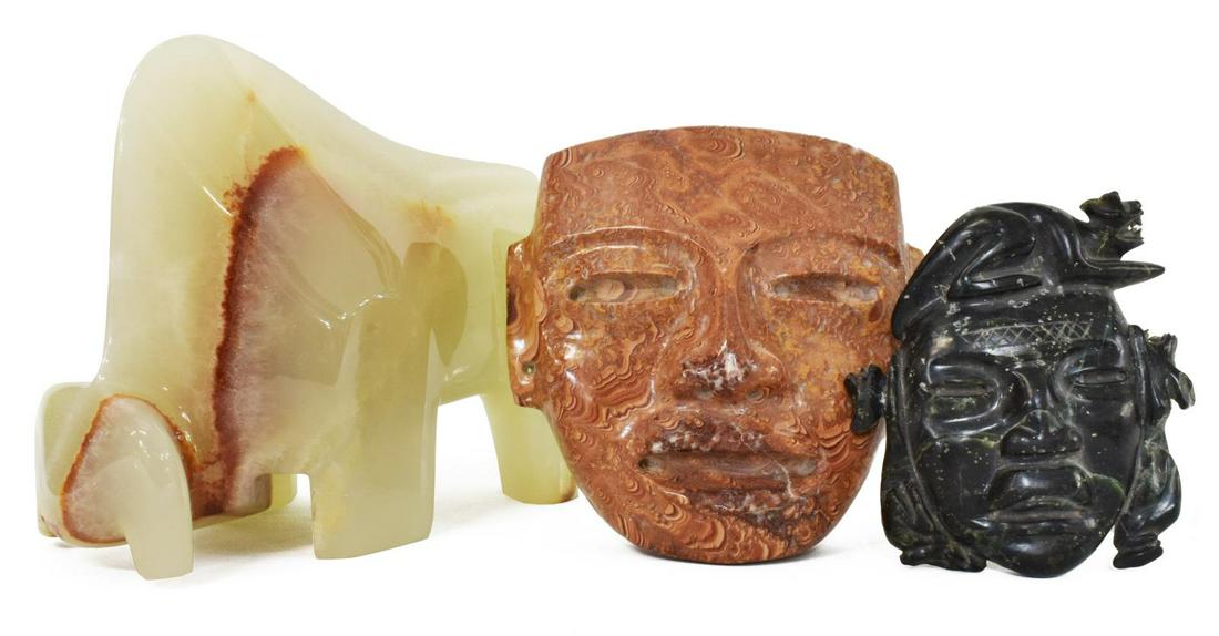 (3) VINTAGE MEXICO CARVED ONYX BULL, STONE MASKS: (lot of 3) Vintage stone carvings, Mexico, 20th c., including: (1) onyx sculpture of a bull, Tellez, Tecali, Puebla, abstracted form, approx 7.25"h, 11.25"l, 4"w, (2) Pre-Columbian style masks, larges