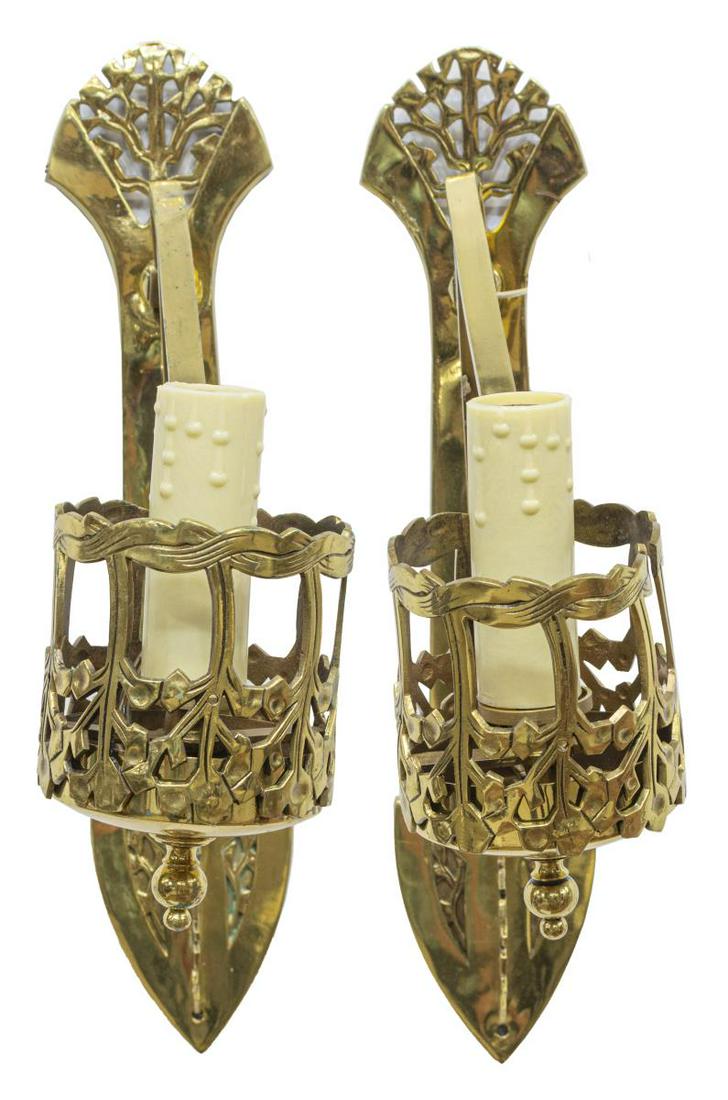 (2) ARTS & CRAFTS STYLE HANGING BRASS WALL SCONCES: (pair) Arts and Crafts style brass wall sconces, mid 20th c., each having scrolled arm terminating in openwork case holding a single faux candle light, approx 17"h, 4.25"w, 13"d; 6.75lbs total Start P