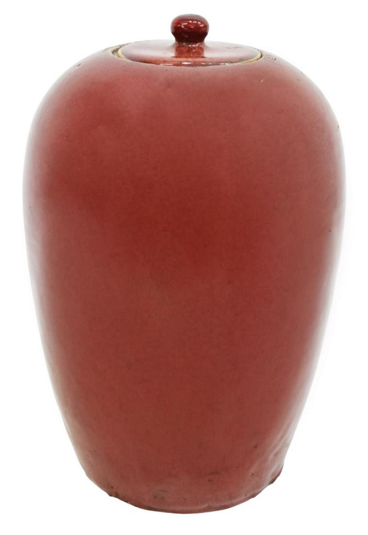 CHINESE SANG DE BOEUF PORCELAIN MELON JAR: Chinese porcelain melon jar, thick application of sang de boeuf (oxblood) glaze, lid with knopped finial, tapered body, approx 12.75"h, 8.25"diam, 7.75lbs **Provenance: From the estate of Ali A. Abssi
