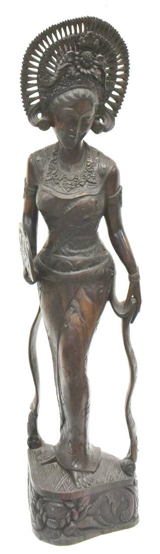 LARGE SOUTHEAST ASIAN CARVED HARDWOOD FIGURE: Large Southeast Asian carved hardwood female figure, Bali, with ornate headdress and fan, approx 40.25"h, 10"w, 9"d **Provenance: From the estate of Ali A. Abssi (1934-2020) and Florence Hall Abssi (1