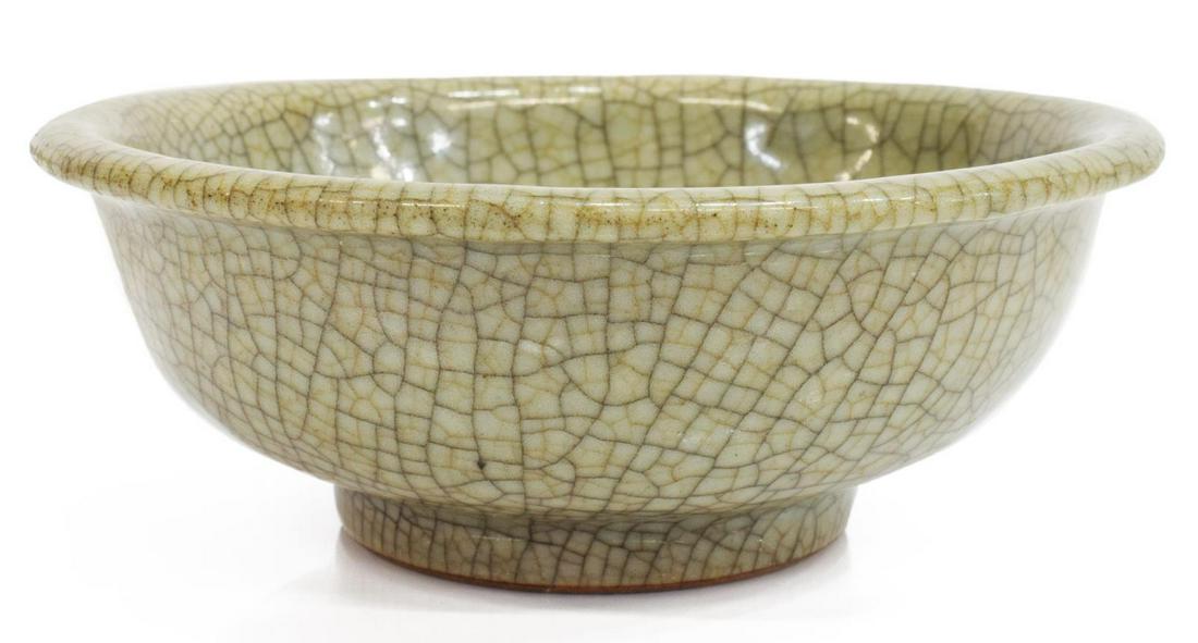 CHINESE CELADON CRACKLE GLAZE LOW BOWL: Chinese porcelain low bowl, in a pale celadon crackle glaze, turned rim, approx 2"h, 5.25"diam, 0.67lbs **Provenance: From the estate of Ali A. Abssi (1934-2020) and Florence Hall Abssi (1919-2014), f
