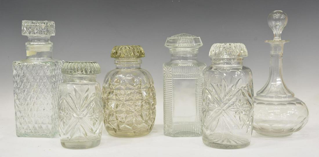 (6) GROUP OF CUT GLASS DECANTERS & STOPPERS: (lot of 6) Group of cut glass decanters, 20th c., of various size, having star, thumbprint, and diamond patterns, largest: approx 11"h, 6"diam, 12lbs total Start Price: $80.00
