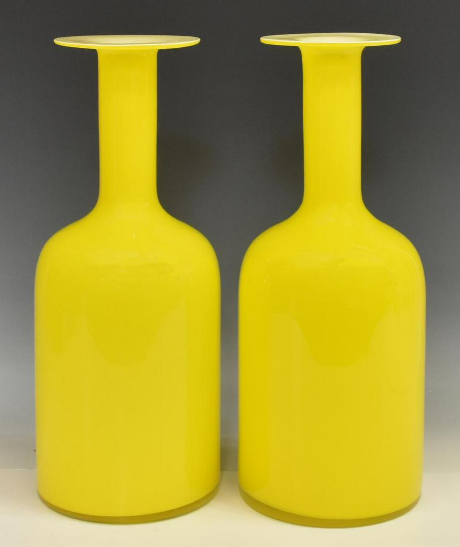 (2) HOLMEGAARD (ATTRIB.) CASED GLASS 'GULVASE': (lot of 2) Modern "Gulvase," attributed to Otto Brauer (Danish, 1897-1938) for Kastrup-Holmegaard, mid 20th c., yellow cased glass, with flat rim, bottle neck, cylindrical body, unmarked, approx 14.75