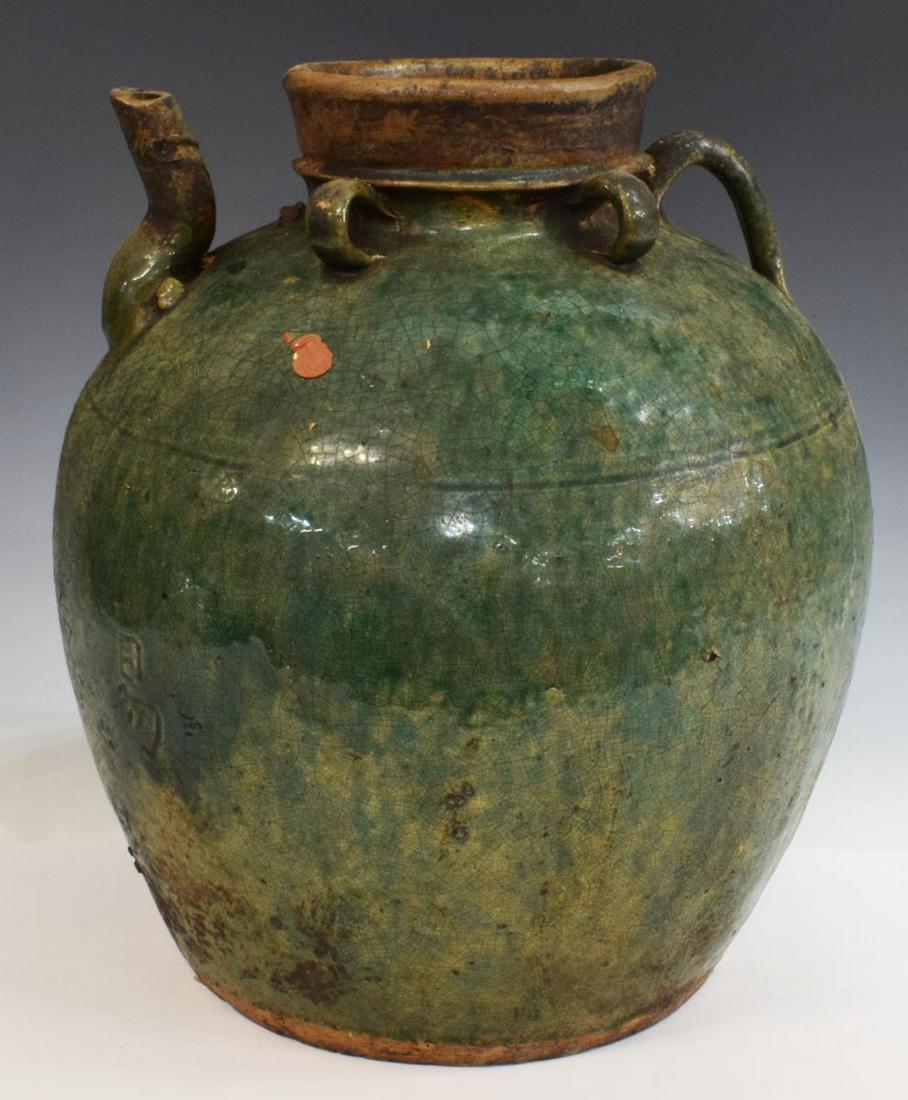 LARGE CHINESE GREEN GLAZED EARTHENWARE OIL JAR: Large Chinese earthenware oil jar, in green glaze, with spout and handle, inscribed characters to one side, retaining partial wax seal, approx 14"h, 11.5"diam, 14lbs Start Price: $50.00