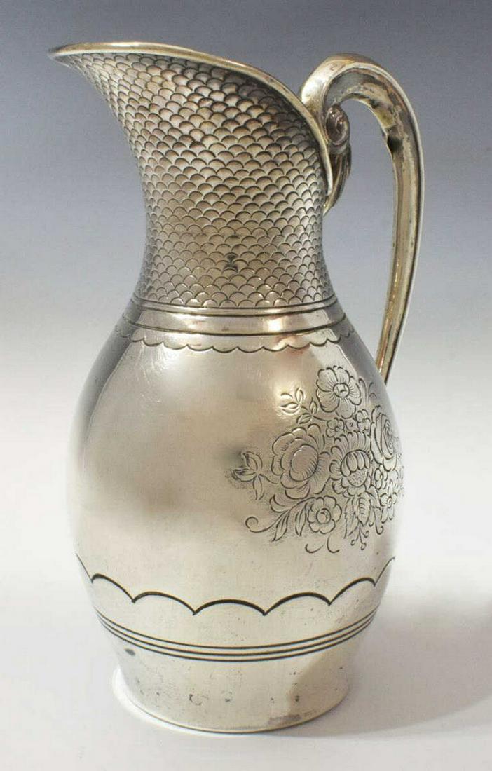 SPANISH J. PEREZ FERNANDEZ .915 SILVER PITCHER: Spanish .915 silver pitcher, J. Perez Fernandez (Spanish, 20th c.), with scrolled handle, scallop-patterned spout, chased floral sprays, approx 9.25"h, 4.75"diam, 15.23ozt Start Price: $200.00