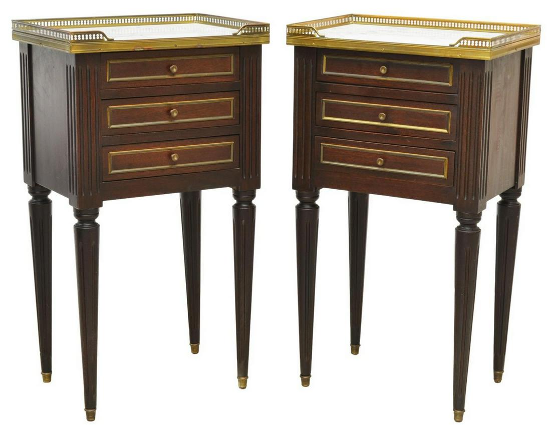 2) LOUIS XVI STYLE MARBLE-TOP MAHOGANY NIGHTSTANDS: (pair) French Louis XVI style marble-top mahogany nightstands, early 20th c., pierced gilt-metal gallery, over three drawers, with gilt metal trim, rising on tapered and fluted legs, terminating in me