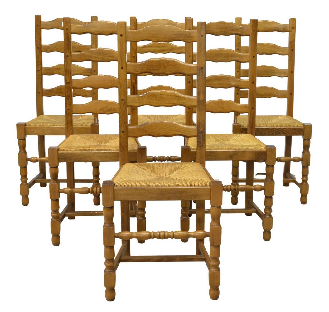 (6) FRENCH PROVINCIAL FRUITWOOD LADDER-BACK CHAIRS: (lot of 6) French Provincial fruitwood dining chairs, early 20th c., having shaped ladder back, over woven rush seat, rising on stretcher-joined turned legs, on bun feet, approx 40"h, 17"w, 15"d, seat