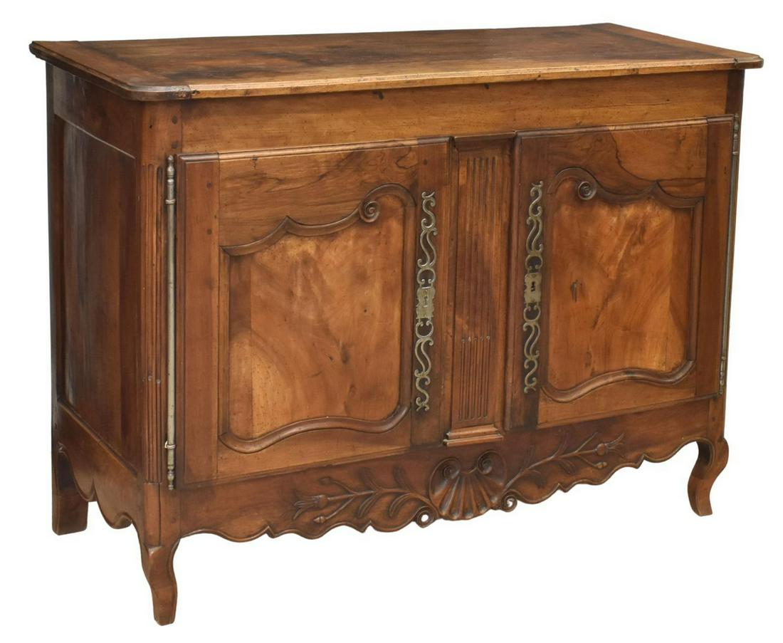 FRENCH PROVINCIAL LOUIS XV STYLE SIDEBOARD: French Louis XV style sideboard, early 19th c., having a rectangular top, over two burl paneled doors, opening to the shelved interior, the skirt with foliate and shell carving, rising on reduced heig