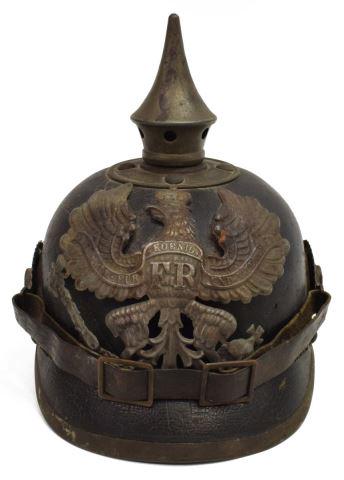 GERMAN WWI-ERA SPIKE PICKELHAUBE HELMET: German pickelhaube helmet, fitted with metal front plate depicting the Prussian coat of arms, polished leather body, metal-rimmed visor, neck guard, interior leather liner maker illegibly stamped and 