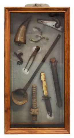 OLD WEST SHADOW BOX, KNIFE, BULLET MOLD, HORN: Framed shadow box displaying Old West items, including: (1) French percussion rifle lockplate; (1) antique spur with heel spike; (1) powder horn; (1) bullet mold; (1) percussion hammer, (1) iron ladle